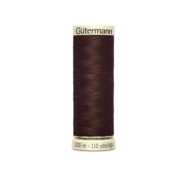 Spool of dark brown thread with Gutermann branding.