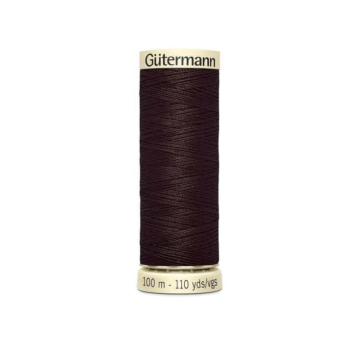 Spool of dark brown thread with Gutermann branding.