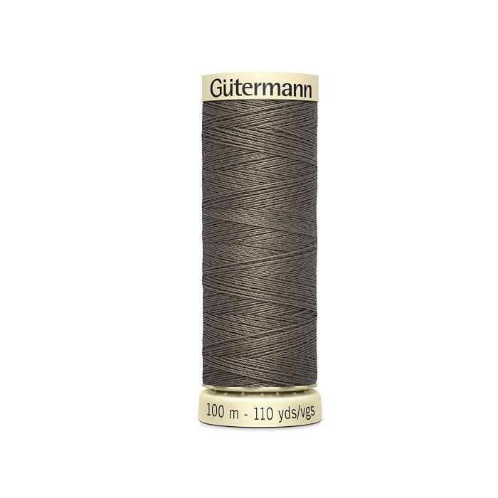 Spool of brown thread with Gutermann branding.