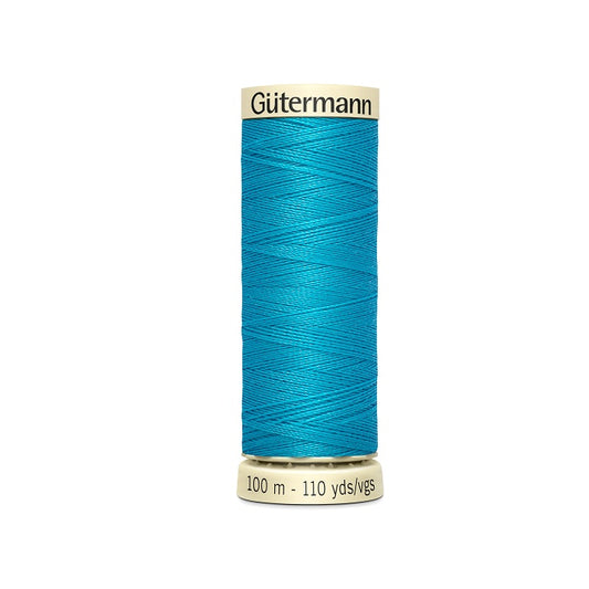 Spool of blue thread with Gutermann branding.
