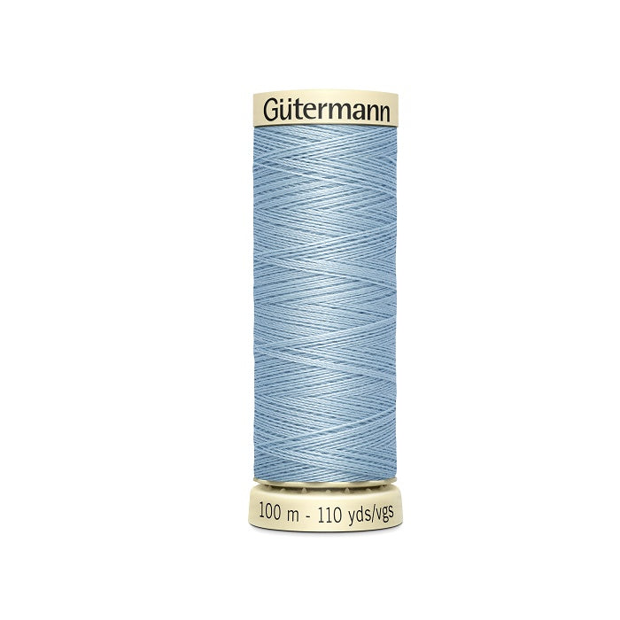 Spool of light blue thread with Gutermann branding.