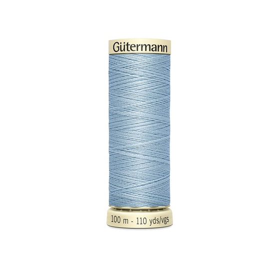 Spool of light blue thread with Gutermann branding.