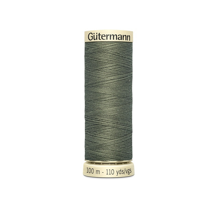 Spool of green thread with Gutermann branding.