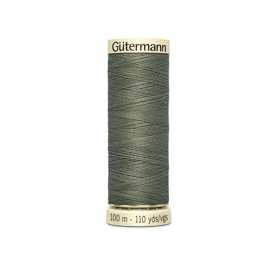 Spool of green thread with Gutermann branding.