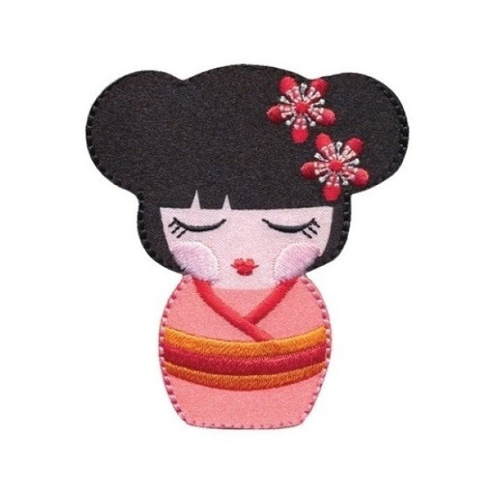 Applique of girl with closed eyes wearing a pink kimono.