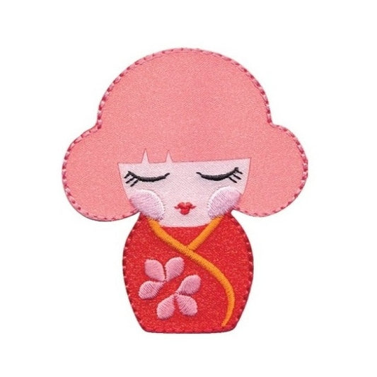 Applique of girl with closed eyes wearing a red kimono.