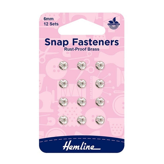 Pack of 6mm silver snap fasteners with Hemline branding.