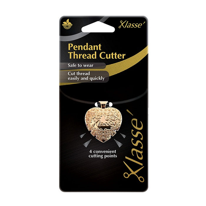 Gold heart shaped thread cutter pendant with Klasse branding.