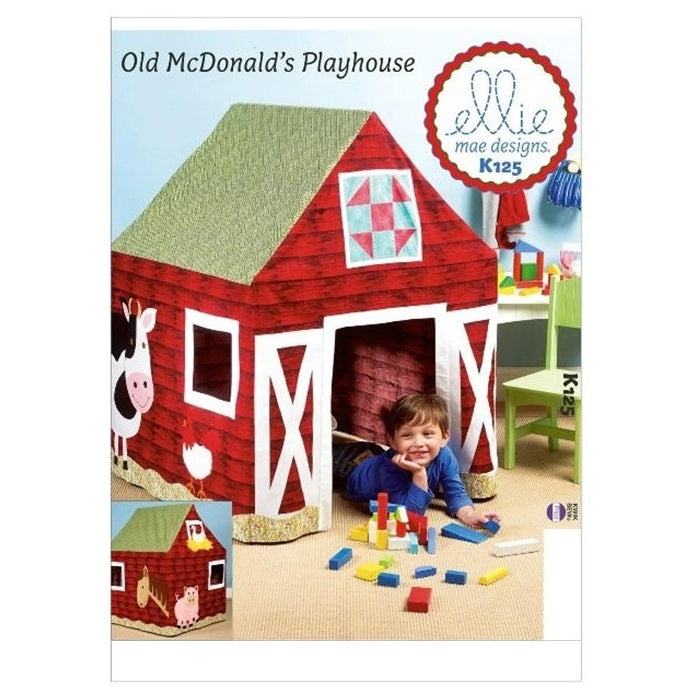 Sewing pattern cover with fabric barn playhouse.