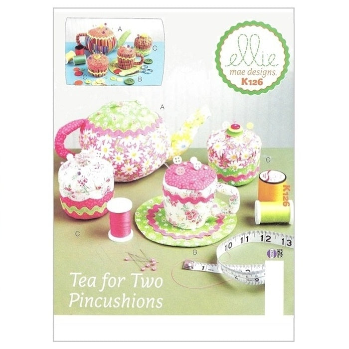 Sewing pattern cover with teaset pincushions.