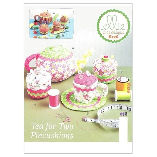 Sewing pattern cover with teaset pincushions.