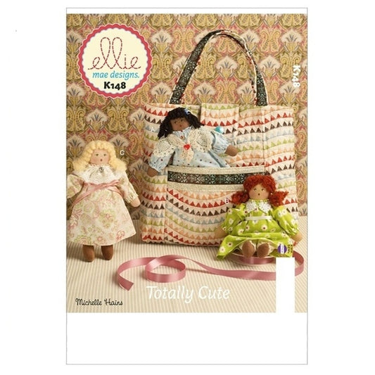 Sewing pattern cover with tote and fabric dolls.
