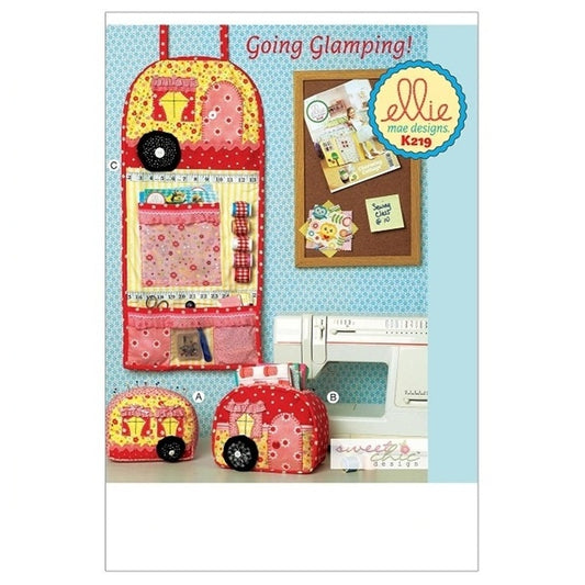 Sewing pattern cover with appliqued sewing room accessories.
