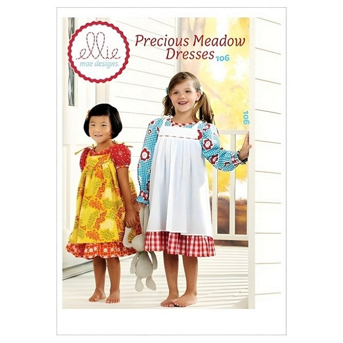 Pattern cover with childres colourful dresses and pinafore aprons.