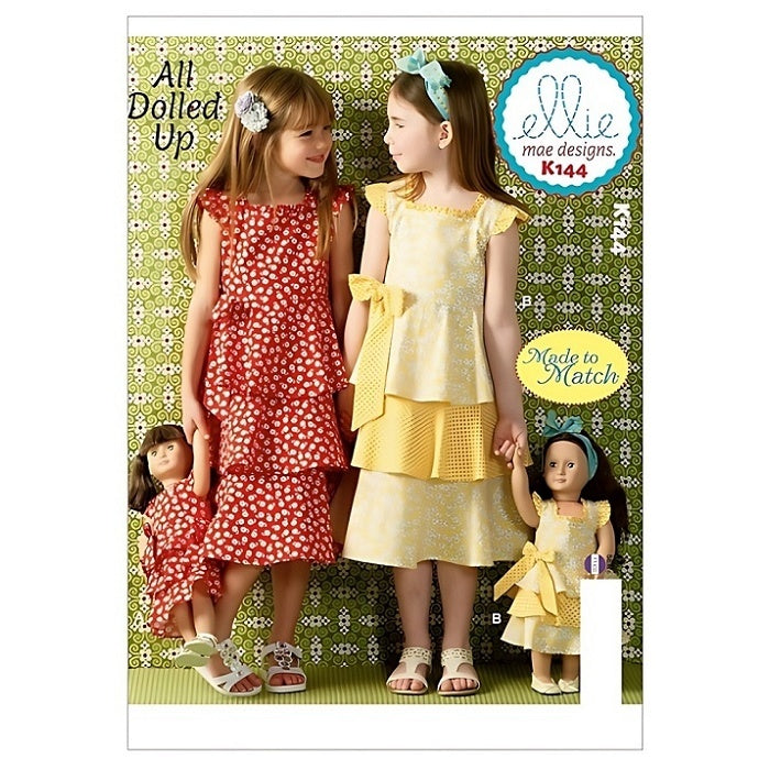 Pattern cover with two children and dolls in matching dresses.