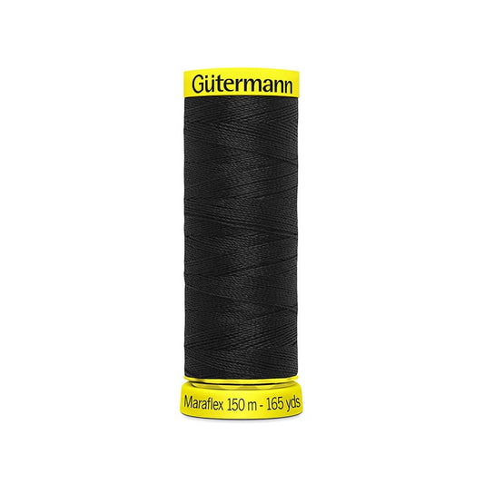Spool of black elastic thread with gutermann branding.