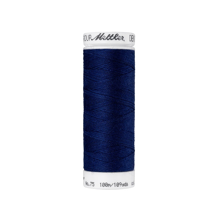 Spool of dark blue thread with Mettler branding.