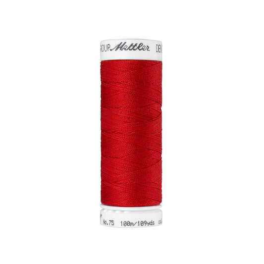 Spool of red thread with Mettler branding.