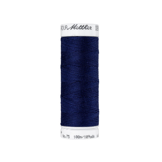 Spool of dark blue thread with Mettler branding.