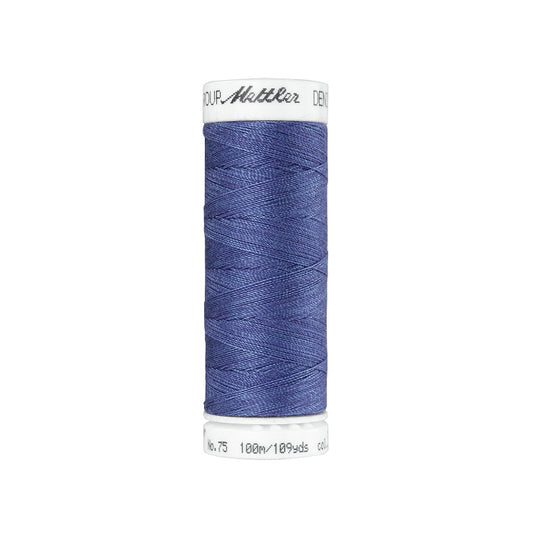 Spool of indigo blue thread with Mettler branding.