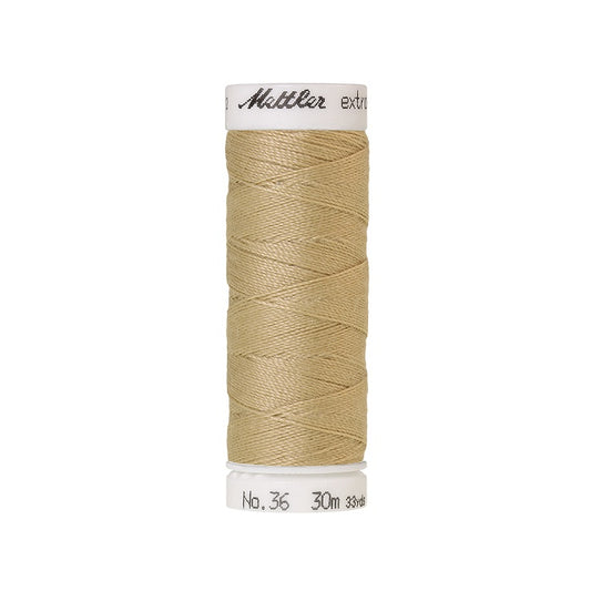Spool of beige extra strong thread with Mettler branding.