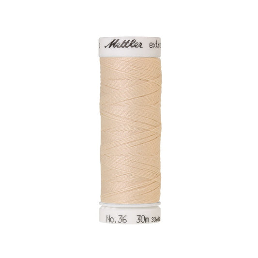 Spool of beige extra strong thread with Mettler branding.