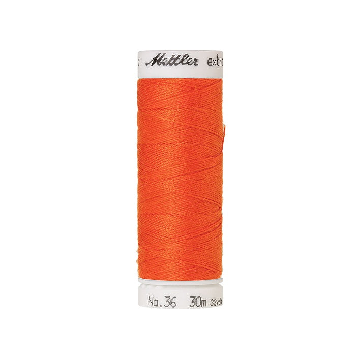 Spool of orange extra strong thread with Mettler branding.