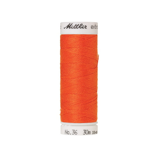 Spool of orange extra strong thread with Mettler branding.