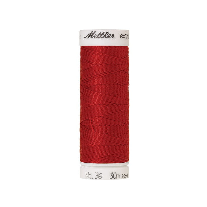 Spool of red extra strong thread with Mettler branding.