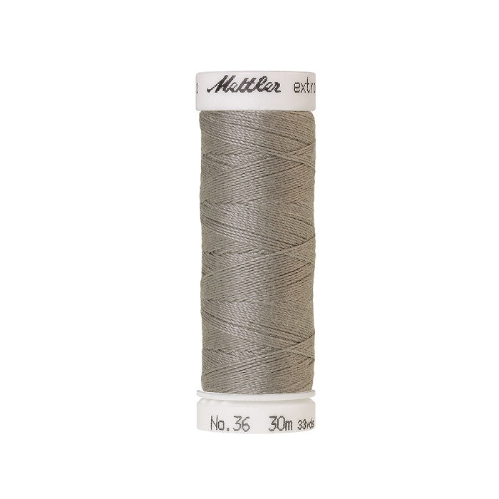 Spool of grey extra strong thread with Mettler branding.