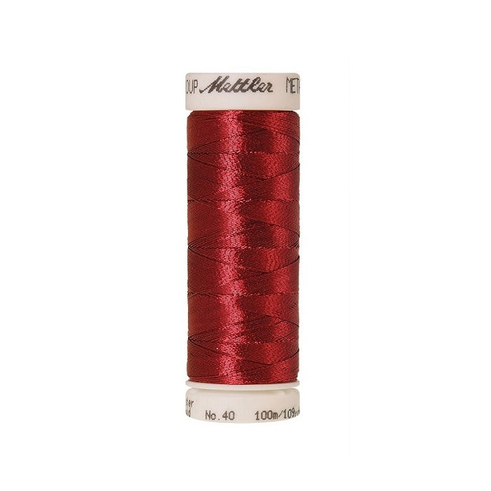 Spool of red metallic thread with Mettler branding.