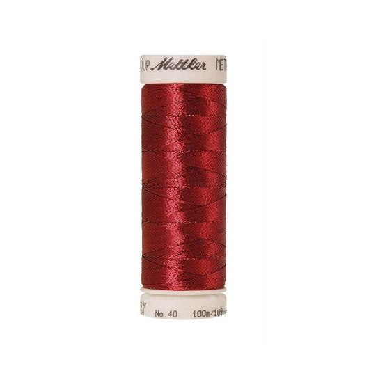 Spool of red metallic thread with Mettler branding.