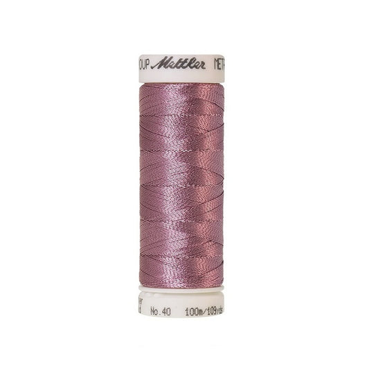 Spool of pink metallic thread with Mettler branding.