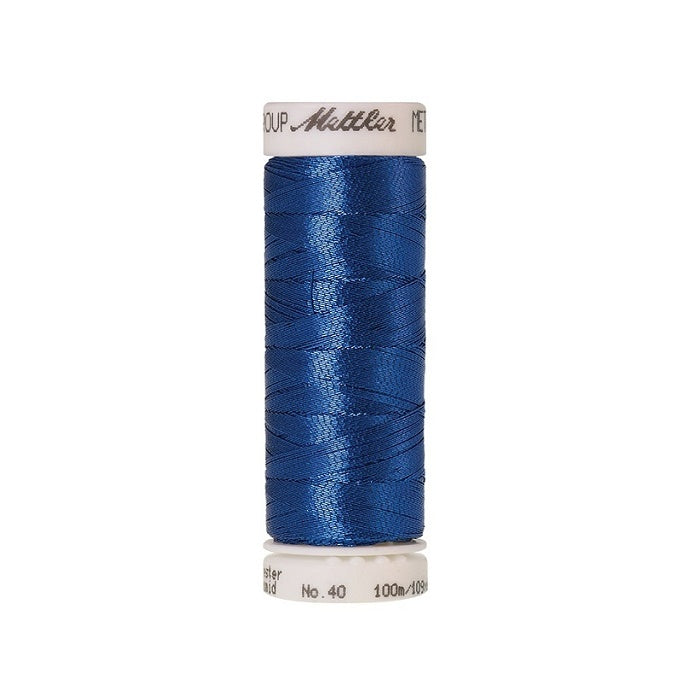 Spool of blue metallic thread with Mettler branding.