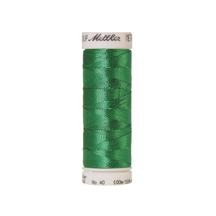 Spool of green metallic thread with Mettler branding.