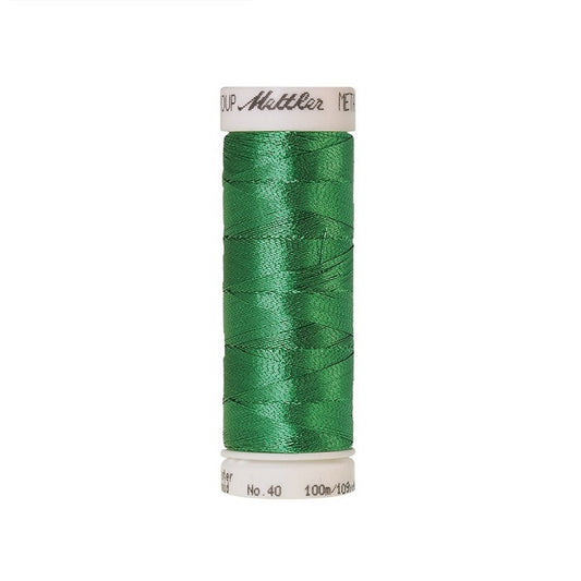 Spool of green metallic thread with Mettler branding.