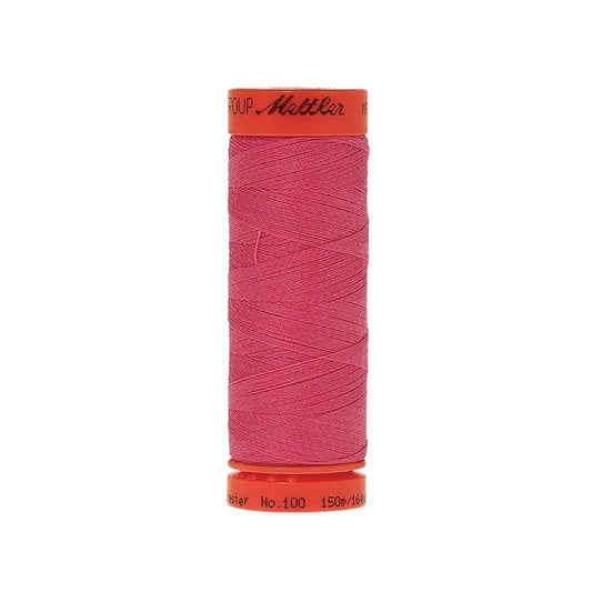 Spool of Mettler 150m dark pink thread.