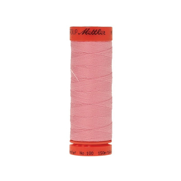 Spool of Mettler 150m pink thread.