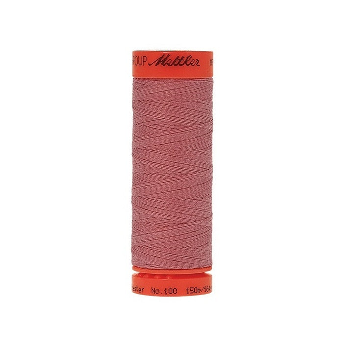 Spool of Mettler 150m dark dusky pink thread.