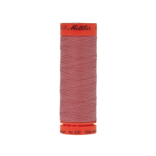 Spool of Mettler 150m dark dusky pink thread.