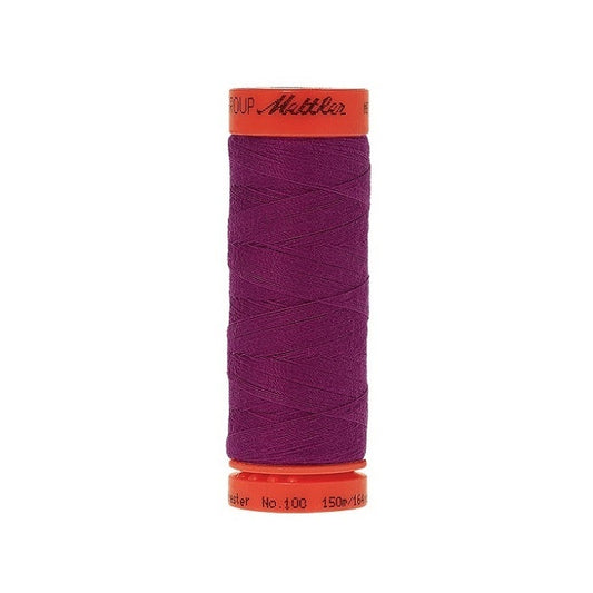 Spool of Mettler 150m purple thread.