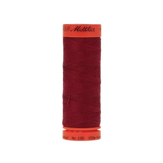 Spool of Mettler 150m dark red thread.