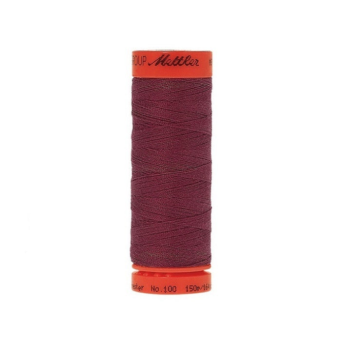 Spool of Mettler 150m dark red thread.