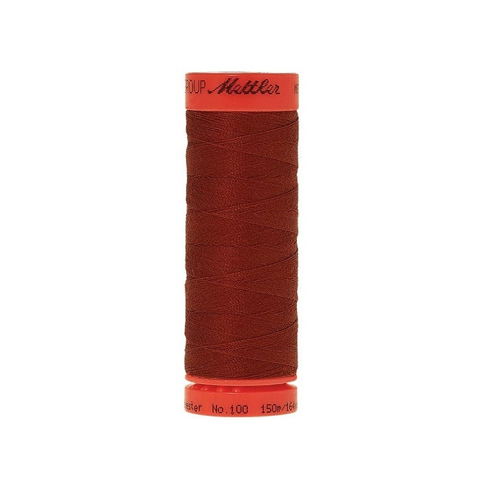 Spool of Mettler 150m brown red thread.