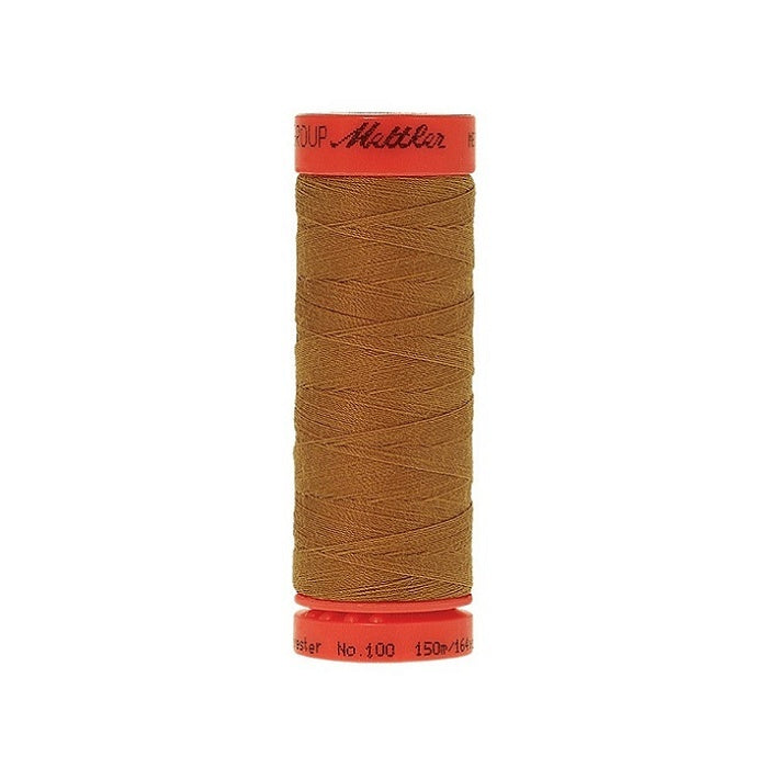 Spool of Mettler 150m tan brown thread.