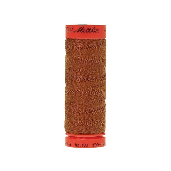 Spool of Mettler 150m warm brown thread.