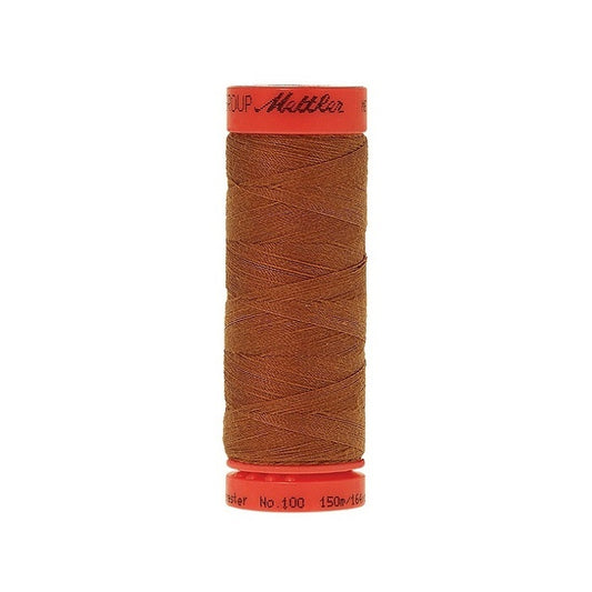 Spool of Mettler 150m warm brown thread.