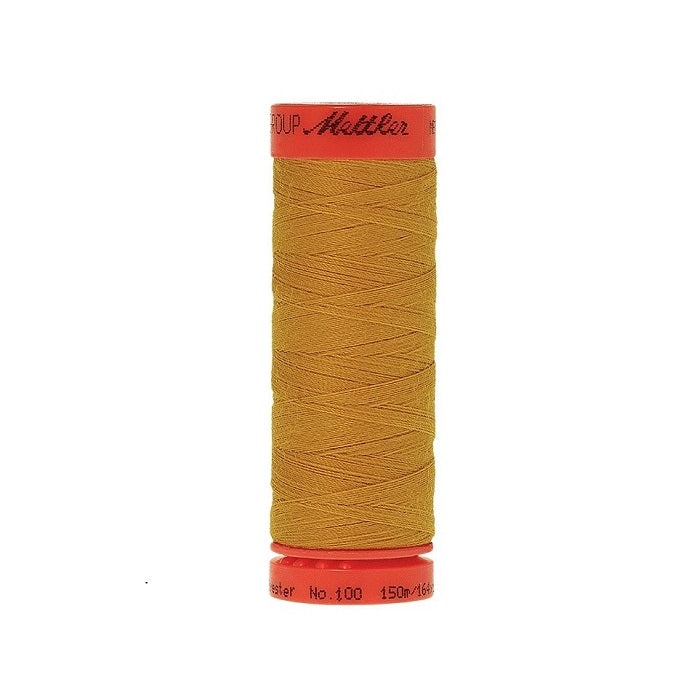 Spool of Mettler 150m gold thread.