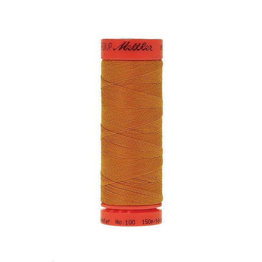 Spool of Mettler 150m orange gold thread.