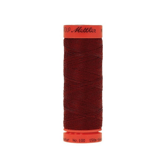 Spool of Mettler 150m dark blue red thread.